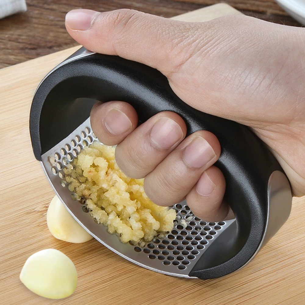 https://kindcooking.com/wp-content/uploads/2021/07/Multi-function-Grinding-Slicer-Stainless-Steel-O-shaped-Garlic-Ginger-Press-Hand-Held-Kitchen-Rolling-Crusher.jpg